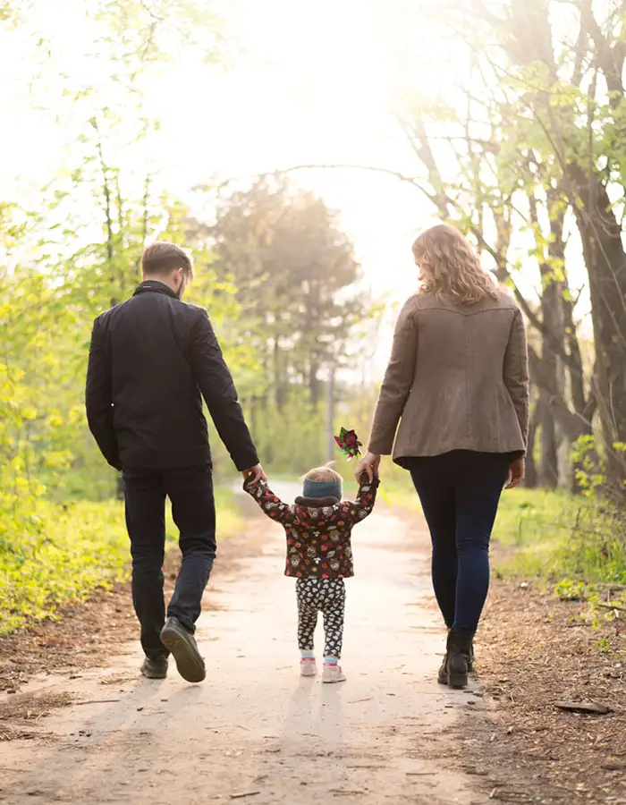 happy-parents-with-child-nature