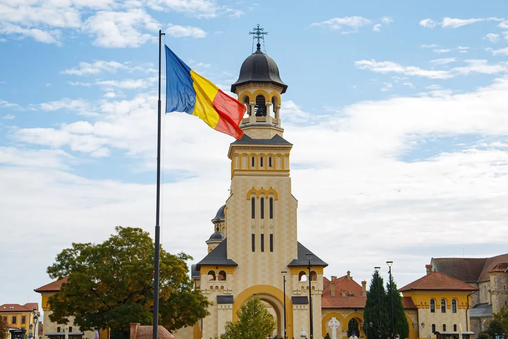 scenic-view-of-the-romanian-flag-against-the-cathe-2025-02-08-19-46-44-utc