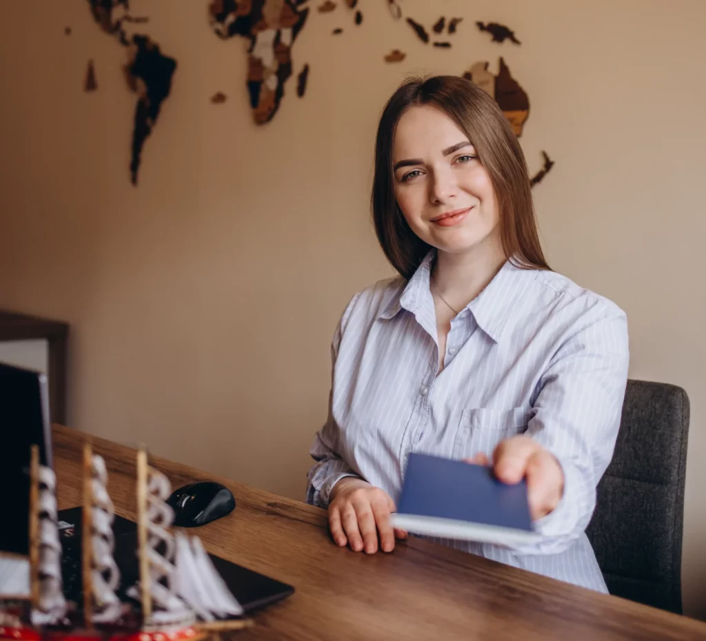 young-pretty-travel-agent-giving-tickets-to-client-2025-03-17-13-13-34-utc